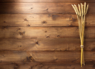 Canvas Print - ears of wheat on wooden background