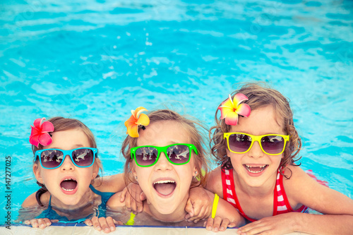 Happy children in the swimming pool