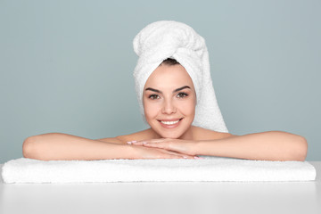 Wall Mural - Beautiful young woman after bath on color background