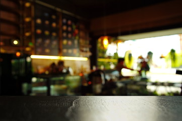 top of black wood table with cafe or pub at night