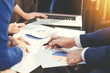 © vacancylizm - Business man working at office with laptop and documents,businessmen using documents at meeting,Teamwork Togetherness Unity Variation Support Concept,Business team analyzing financial documents.