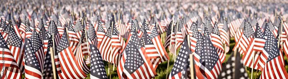 Memorial Day tribute. Thousands of tiny flags in a field. Faded vintage color. Banner format - obrazy, fototapety, plakaty 