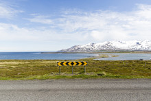 A Landscape And Traffic Sign Near The Sea In Iceland.
