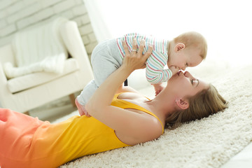 Woman playing with baby 