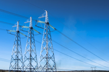 Power line against the blue sky