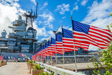 American Flags In Line At Missouri Warship Memorial In Pearl Harbor Honolulu Hawaii, Oahu Island Of United States. National Historic Patriotic Landmark.