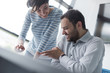 © .shock - Two Business People Working With Tablet in startup office