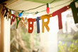 © Connect Images - Birthday banner hanging in window