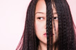 © Image Source - Woman with crimped hair covering face