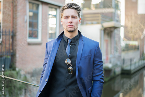 Handsome Young Man With Short Hair Wearing Classic Blue Suit And