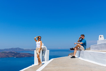 Young couple walking on  Santorini