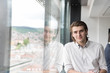 © .shock - young businessman in startup office by the window