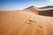 Human foot prints on sand dunes in the arabian desert 
