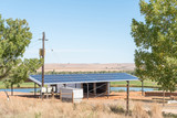 Fototapeta Paryż - Solar power installation on a farm near Stormsvlei