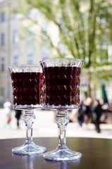 Two crystal glasses on terrace in a cafe