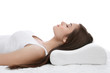 Young woman sleeping on bed with orthopedic pillow against white background. Healthy posture concept