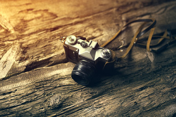 Poster - camera on wood table background