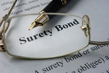 Page Of Newspaper With Words Surety Bond.  