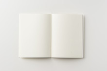 Business Concept - Top View Of Blank Notebook On White Background Desk For Mockup