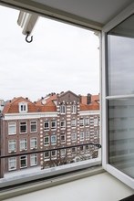 Facades Of Houses In Amsterdam Seen From A Window Across The Street