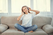 © svetabezu - Beautiful teenage girl with smartphone and headphones listening music.