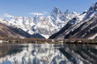 © explorich - Lake and high mountains in clear weather, traveling and hiking.