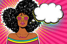 Wow Pop Art Face. Sexy Woman With Black Afro Curly Hair And Open Mouth And Sunglasses In Form Of Heart And Empty Speech Bubble. Vector Bright Background In Pop Art Retro Comic Style. Party Invitation.