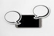 Mobile phone sideways in horizontal position with 2 speech bubbles. Smartphone with blank screen. Free copy space for text. Paper speech balloon and cellphone on white background. Chat concept.