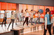 © svetabezu - Children healthy lifestyle concept - group of sportive of teenage girls exercising in the gym