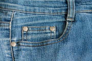 View Of Background Texture Of Two Pocket Jeans With Seams Close Up.