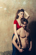 © Volodymyr - Pretty girl hugging bearded man or sexy bodybuilder