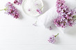 Natural bath salt, cotton towels and lilac flowers (symbolic image)