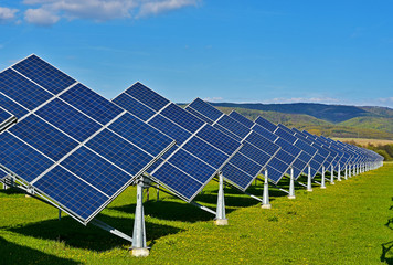 green energy - photovoltaic power plant on green meadow