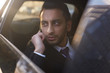 © pressmaster - Portrait of handsome Middle-Eastern businessman speaking by smartphone inside expensive car
