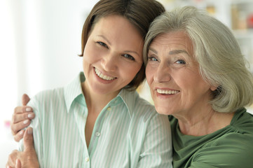 Wall Mural - Beautiful elderly mother with an adult daughter