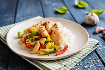 Wall Mural - Fried chicken breasts pieces served with steamed vegetable and rice