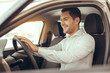 © Friends Stock - Young Man in a Car Rental Service Test Drive Concept