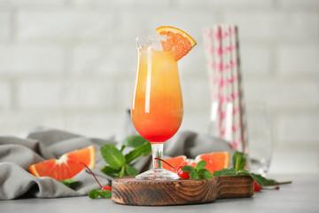 Delicious tequila sunrise cocktail on table