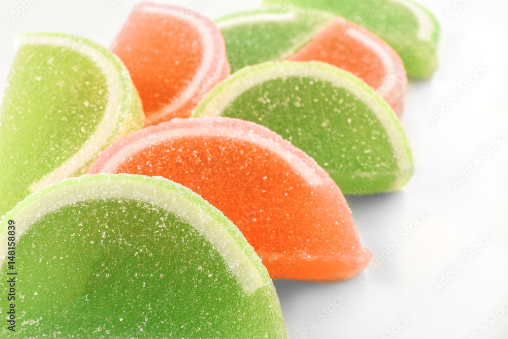 Tasty jelly candies on white background, closeup