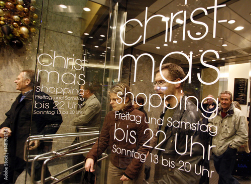 People Leave Kadewe Department Store Through Door Announcing The