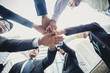 © Bavorndej - business team putting their hands on top of each other,  vintage color tone..