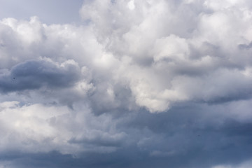 Beautiful blue sky with clouds at sunset. Cloudy sky background.