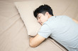 Asian man sleep in bed alone, man sleeping concept, 20s age