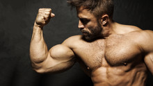 A Muscular Man Flexing His Biceps