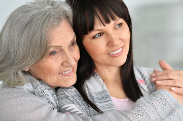 Wall Mural - Beautiful elderly mother with an adult daughter