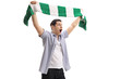 Ecstatic football fan holding a scarf and cheering