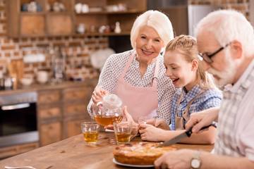 family drinking tea at home