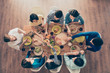 © deagreez - Top view of group of eight happy friends having nice food and drinks, enjoying the party and communication