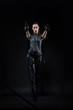© Pixelatelier.at - Superhero woman in a leather catsuit holding guns