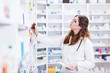 © Karanov images - Pharmacist looking and searching for a medication on pharmacy shelf